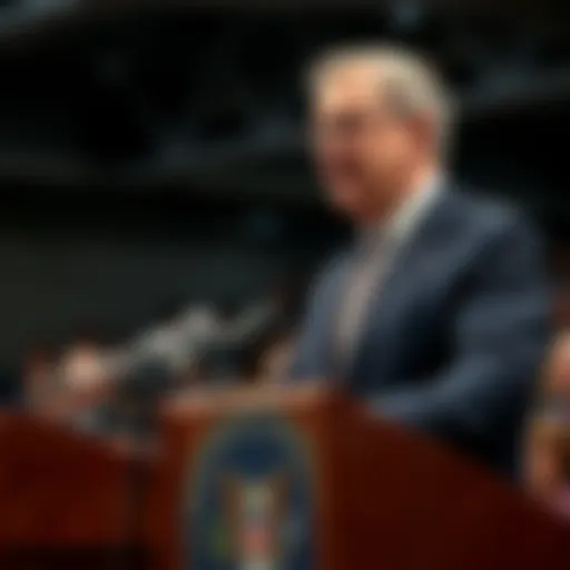 Jerome Powell, US Fed Chair, delivers a speech on inflation concerns at a podium with microphones and an audience in the background.
